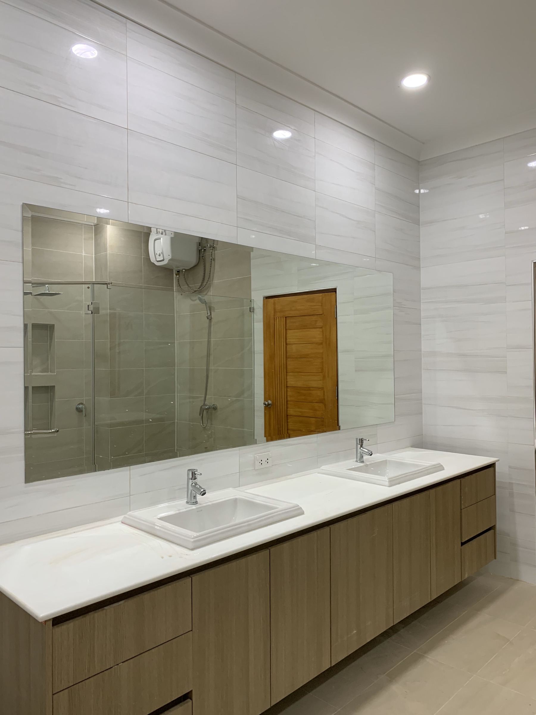 Bathroom Renovation — strip-out and rebuild, new plumbing, vanity, walk-in shower.