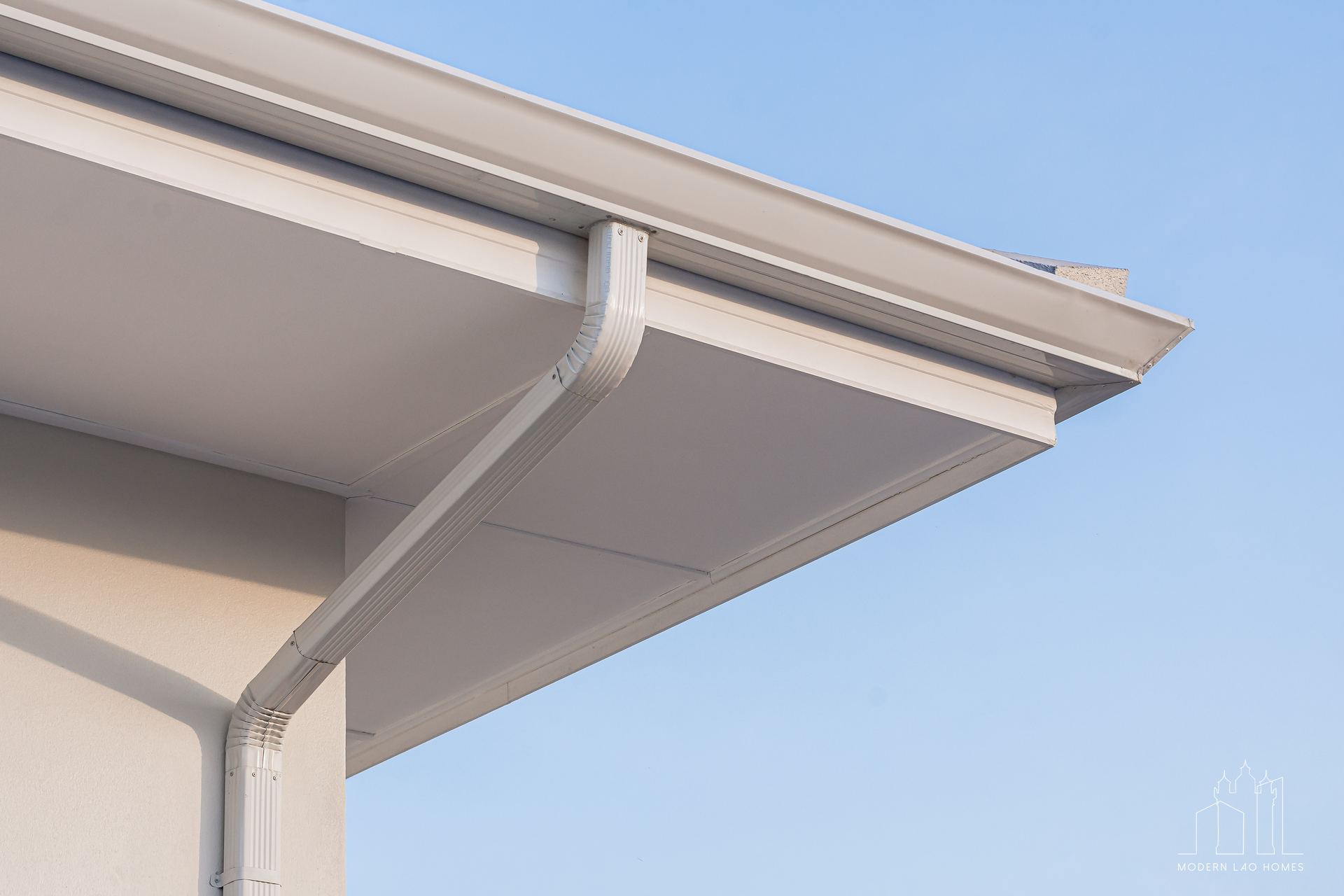 John's House — newest delivery on the ledger, deep eaves, horizontal emphasis.